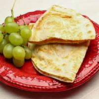 Quesadilla Combo · Cheddar, mozzarella, sliced tomato all baked
With a side of Grapes  and a juice box.