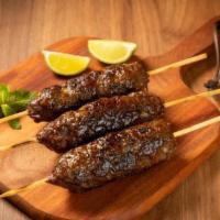 Beef Kofta  · Grilled beef or chicken kofta made with onion and spices and then shaped and skewered onto k...