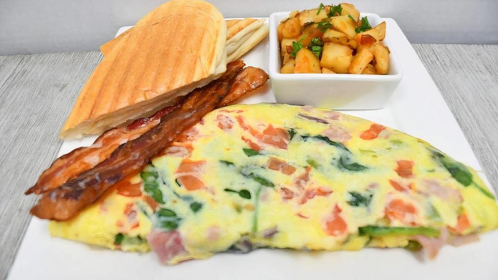 Omelette · 3 egg omelet with your choice of 3 ( ham, spinach, tomato, peppers, mushrooms and cheese) with side of fruit or potatoes and toast.