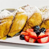 French Toast · 4 thick slices of brioche bread topped with fresh banana and strawberry