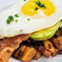 Avocado Breakfast Bowl · Half Hass avocado, 1 fried egg, 2 slices of crispy bacon over house potatoes