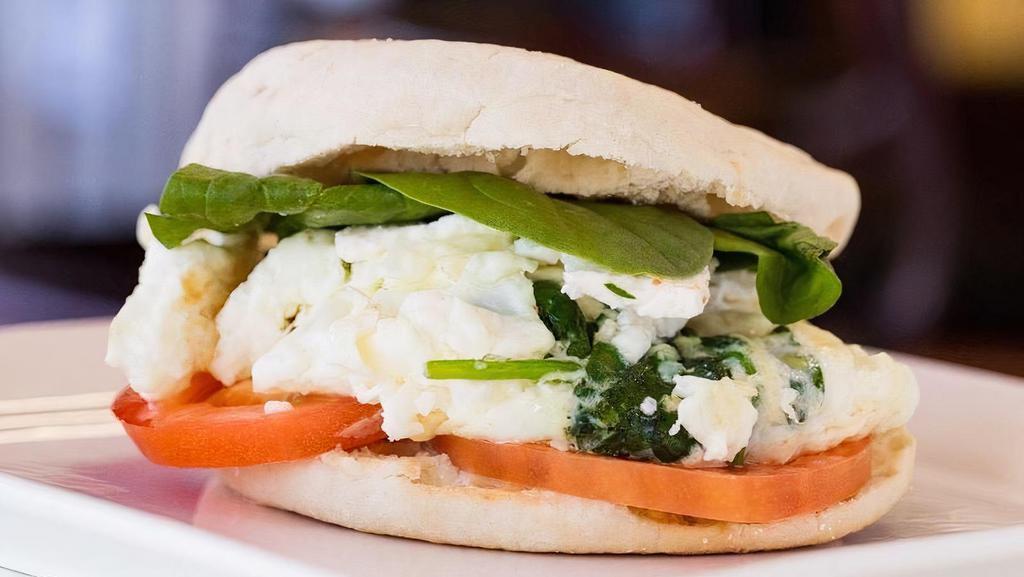 Healthy White · Egg whites tortilla with spinach. Served on tasted English muffin with 2 fresh slices of tomatoes. Topped with feta cheese.