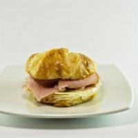 Ham, Cheese, & Egg Croissant · Ham pit ham, Swiss cheese topped with 1 scramble egg on a flaky baked croissant