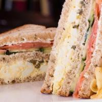Salmon Triple · Egg salad, capers, cucumbers, cream cheese, and smoked nova salmon on 3 layers of our signat...