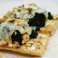 Goat Cheese Spinach Sandwich · Open face ciabatta bread topped with goat cheese, cooked spinach, topped with mozzarella che...