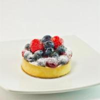 Raspberry Tart · Flaky crust, custard and berries!