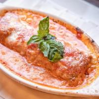 Lasagne · This sheets of pasta layered with meat sauce, cheese, and bechamel sauce.