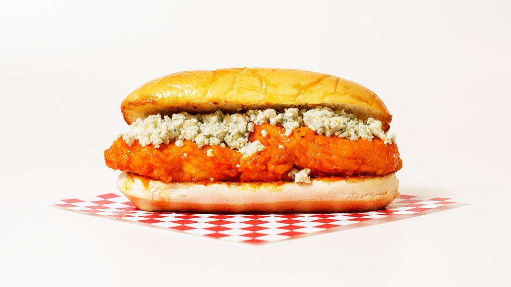 The Buffalo Chicken Sub · Crispy breaded chicken cutlet coated in buffalo sauce topped with blue cheese on a hoagie roll.