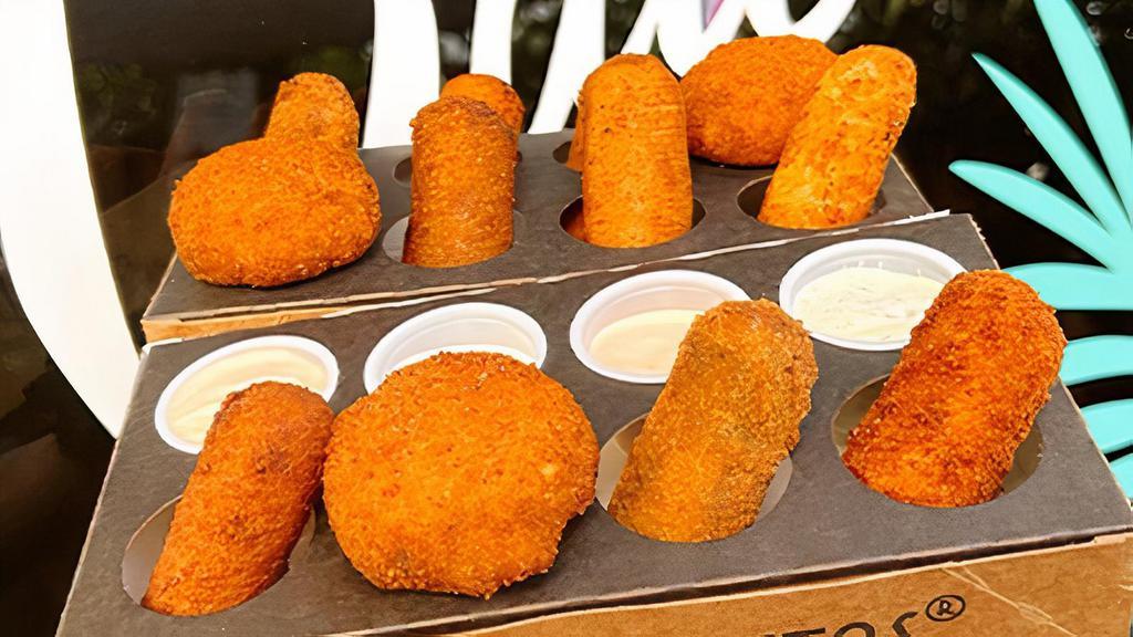 12 | Croqueta Flight™ + Sauces · Mix and match 12 craft croquetas & sauces with your very own Croqueta Flight™. If you’re doubling up let us know which croquetas you'd like in the special instructions box below!