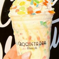 Fruity Pebbles Shake · Fruity pebbles, topped with house made whipped cream, leche condensada drizzle & fruity pebb...