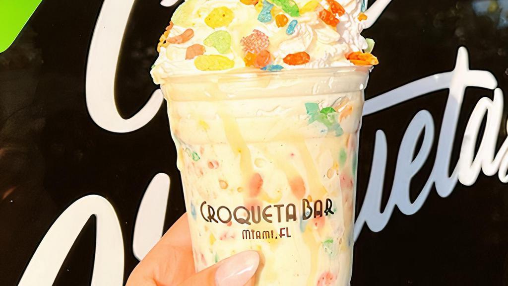 Fruity Pebbles Shake · Fruity pebbles, topped with house made whipped cream, leche condensada drizzle & fruity pebbles