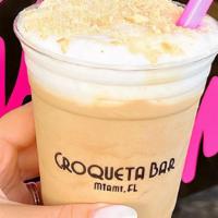 Vegan Colada Shake · Vegan ice cream made with coconut milk, a whole colada, topped with house made vegan whipped...