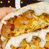 #4 Breakfast Wrap · Dos Croquetas + Bacon crumble + Shredded cheese + Scrambled eggs with our house made sauce i...