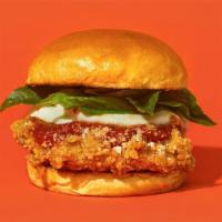 Parmigano · Our signature fried chicken served on a toasted bun and topped with marinara sauce, melted m...