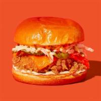 The Og With Cheese · Our signature fried chicken served on a toasted bun and topped with coleslaw, cheddar cheese...