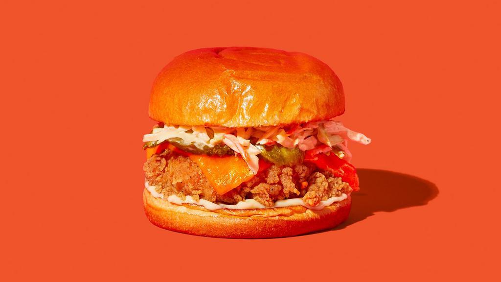 The Og With Cheese · Our signature fried chicken served on a toasted bun and topped with coleslaw, cheddar cheese, pickles, and mayonnaise.