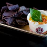 Red Curry Coconut Queso · pickled onions, queso fresco, Thai basil, blue chips. ** Red curry coconut queso contains tr...