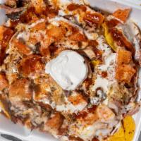 Smoked Loaded Nachos · Chips, cheese, choice of meat (chicken, pork or turkey), sour cream and salsa.