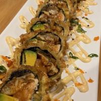 Caribbean Roll · Plantain roll with salmon, eel, cream cheese, and avocado. Deep fried in tempura batter.