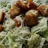 Caesar Salad · Crisp romaine lettuce topped with shaved parmesan cheese and homemade garlic crutons