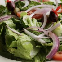 Family House Salad · Crisp romaine lettuce with sliced tomatoes, kalamata olives,  and red onions served with a s...