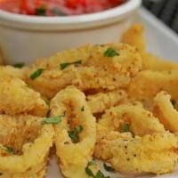 Fried Calamari · Rings of calamari and sliced peppers hand battered with a hint of lemon pepper fried to cris...