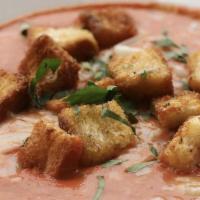 Cup Of Tomato Bisque · Thick and creamy tomato soup topped with shredded mozzarella, fresh basil, and homemade garl...