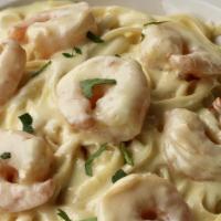 Shrimp Alfredo · Fresh shrimp pan sauteed and simmered in creamy alfredo served over pasta