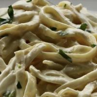 Fettuccini Alfredo · Thick fettuccini noodles smothered in our delicious creamy alfredo sauce