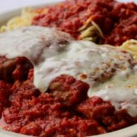 Eggplant Parmigiana · Crisp fried eggplant simmered in marinara and served over pasta with melted mozzarella