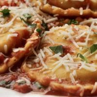 Gf Cheese Ravioli · Gluten Free ravioli noodles stuffed with ricotta cheese and simmered in tomato sauce topped ...