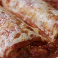 Chicken Cannelloni · 2 large pasta tubes stuffed with chopped grilled chicken, ricotta cheese, and spinach baked ...