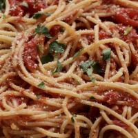 Spaghetti Marinara · Thin spagatini noodles smothered in in homemade marinara