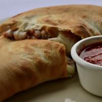 Cheese Calzone · Homemade dough folded and stuffed with ricotta and mozzarella with a side of marinara
