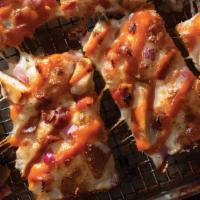 Party Buffalo Ranch Chicken · Jet's® Ranch, premium mozzarella, grilled chicken, bacon & red onions, topped with mild buff...