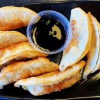 Choo Choo Gyoza (8 Pcs) · Fried dumplings with choice of protein. Served with our gyoza sauce. Steamed available upon ...