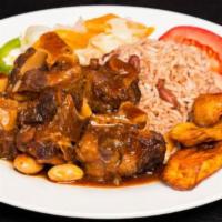 Oxtail · Served with rice and peas or white rice and a side order.