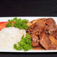 Brown Stew Chicken · Chunks a chicken stew down in we delicious brown stew gravy. served with rice and your choic...