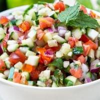 Salad Shirazi  (16 Oz) · Chopped cucumber, tomato, fresh herbs and onion served with house dressing.