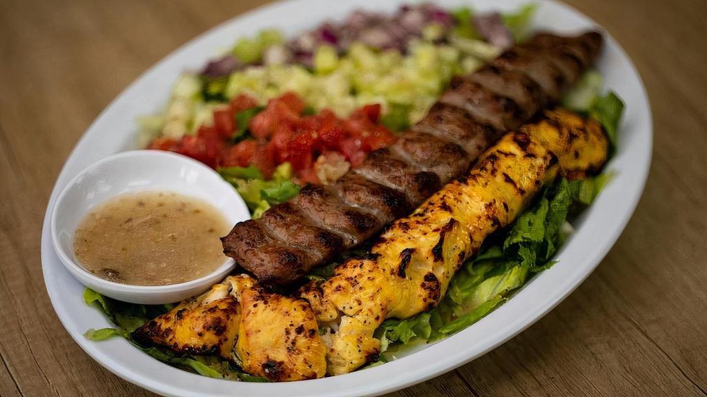 Joojeh Sultani · 1 Skewer of Joojeh Kabob (Marinated Chicken).. 1 Skewer of Koobideh Kabob (Ground Beef & lamb). . Served with your choice of Grain or Salad and Sauce.