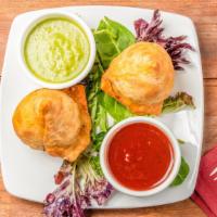 Samosa (2 Pieces) · Nut free. Crispy triangular pastry turnover filled with vegetables (vegan) or  chicken.