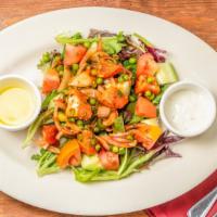 Chicken Tikka Salad · Nut free, gluten free. Fresh mix greens, cucumber, tomato and topped with chopped grilled ch...