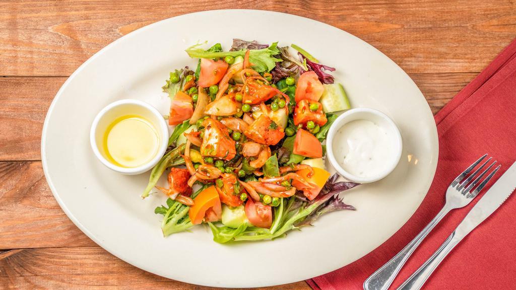 Chicken Tikka Salad · Nut free, gluten free. Fresh mix greens, cucumber, tomato and topped with chopped grilled chicken tikka and served with house dressing.