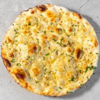 Garlic Naan · Nut free. Has dairy. White flour bread topped with garlic and cilantro baked in a clay oven.