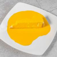 Mango Cheesecake · Creamy homemade New York style cheesecake topped with mango pulp.