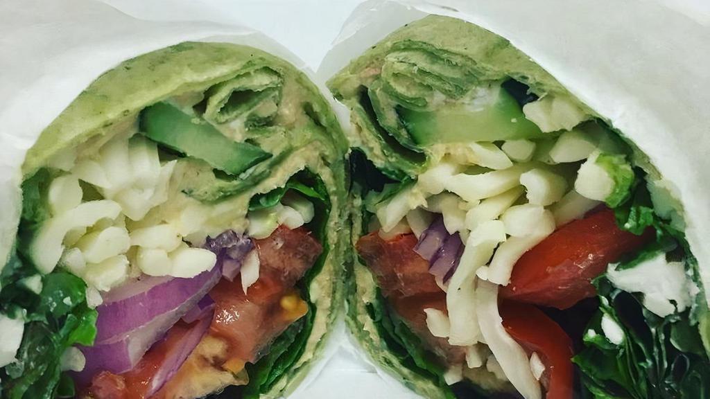 Mediterranean Wrap · Prepared with house made Hummus, Mix Greens, Tomato, Onions, Cucumbers, Shredded Mozzarella on a spinach wrap.