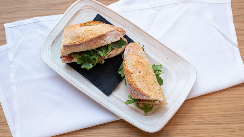 Speck & Brie Cheese · Served on baguette, with speck Italian cured meat speciality of the Italian Dolomite's alps, brie cheese, arugula, figs preserve.