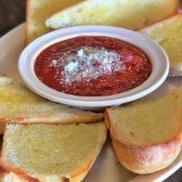 Platter Of Garlic Bread & Marinara · Fresh italian bread with a spread of garlic butter parmesan and romano cheese. with a side o...