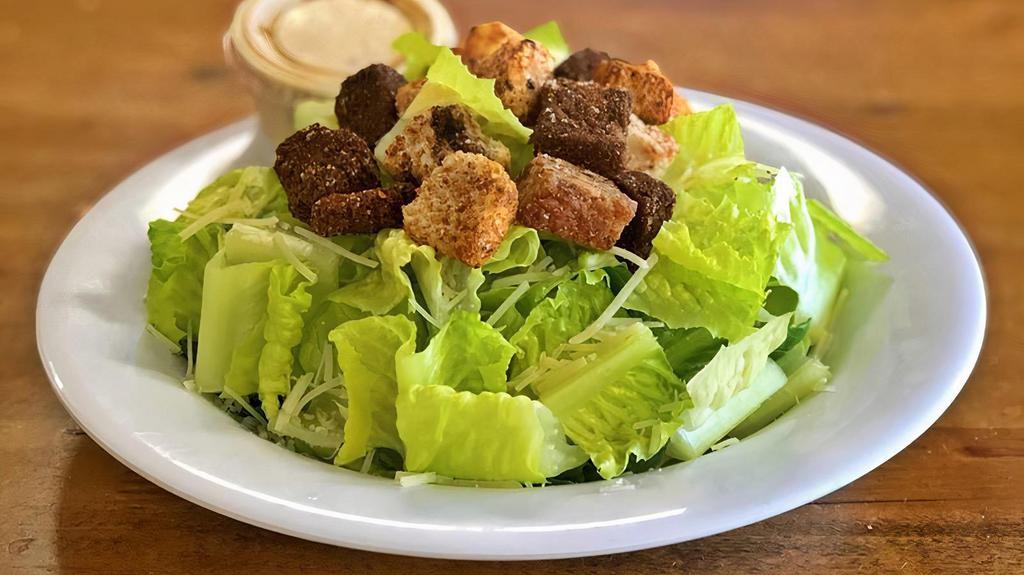 Caesar Salad · Crisp romaine tossed with Caesar dressing, croutons, and shredded parmesan cheese.