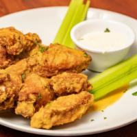 Wings · Mild, Hot, Medium, Blazing. Served with Blue Cheese or Ranch Dressing, Celery Sticks.